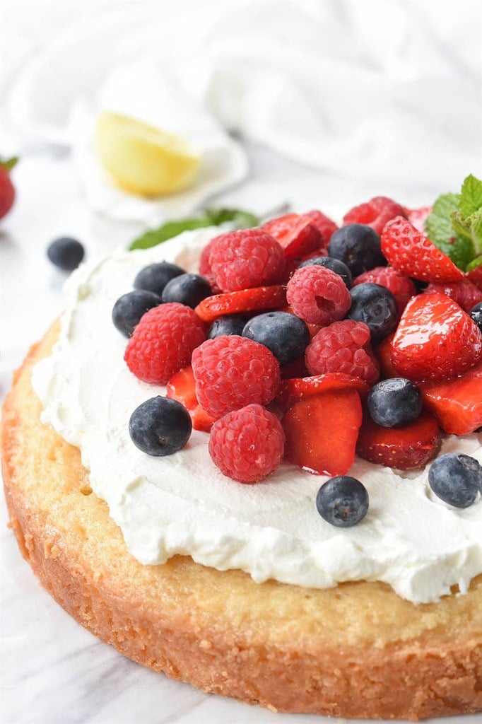 fresh berries and whipped cream topped pound cake