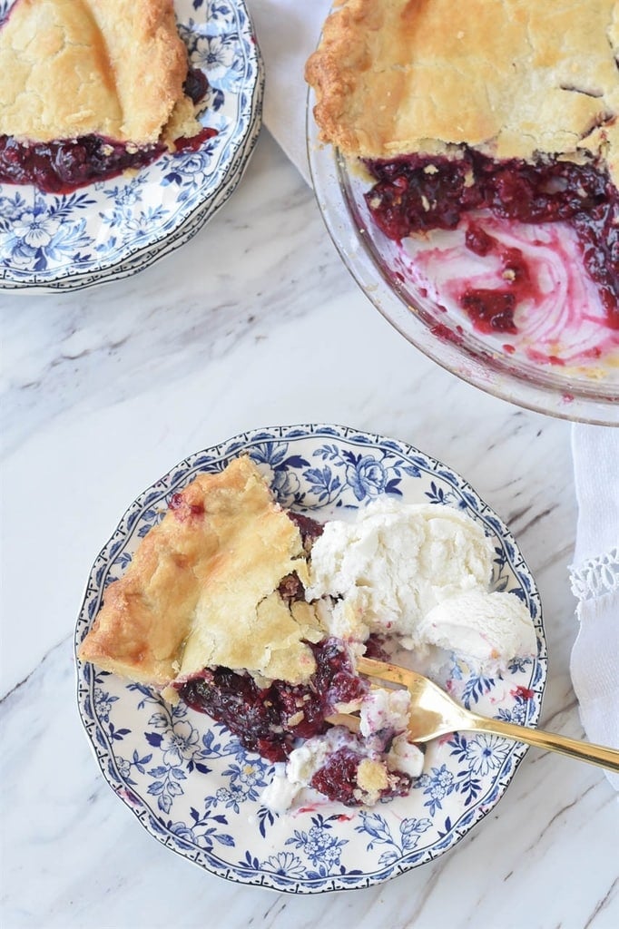 slice of triple berry pie served with ice cream