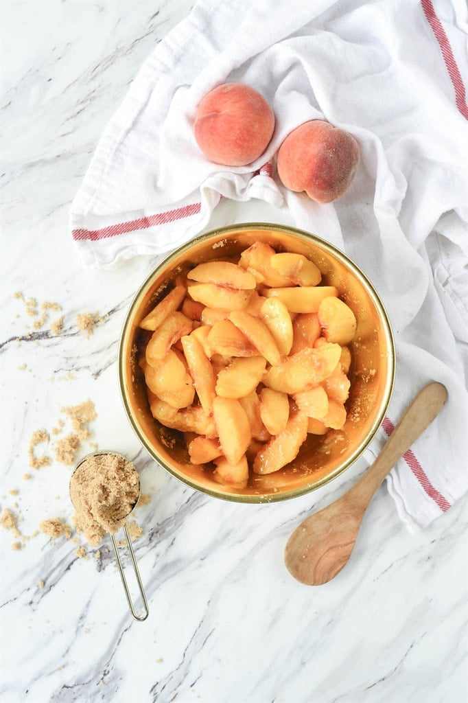 peeled and sliced peaches in a bowl