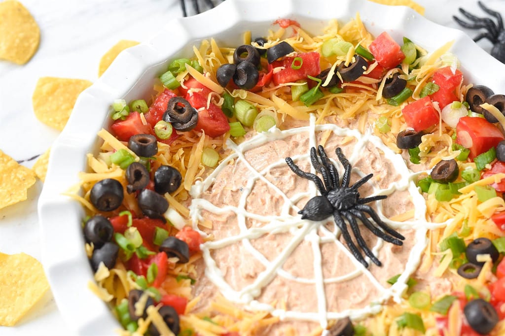7 layer dip with a spider web on top