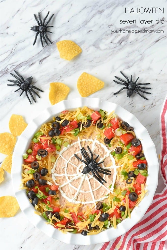 Spider Web Seven Layer Dip in a white dish