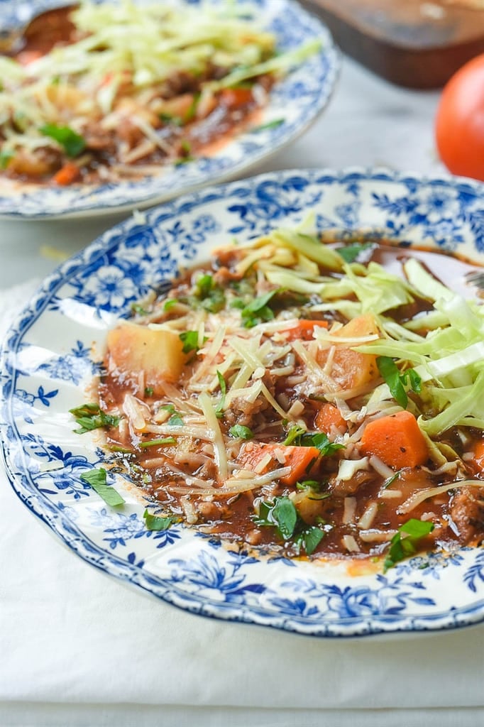 Italian Sausage and Potato Soup topped with cabbage