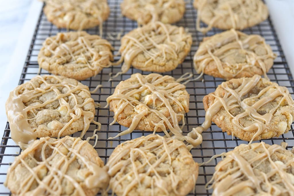 one dozen Maple White Chocolate Chip Cookies on a rack