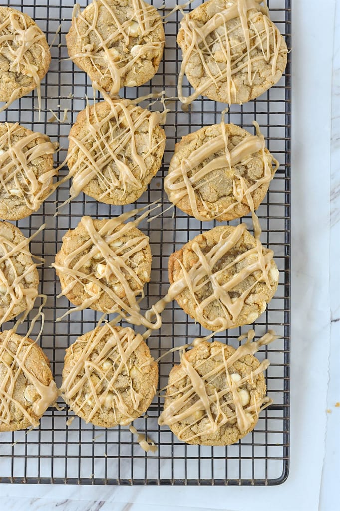 overhead shot of maple white chocolate chip cookies on a cooling rack
