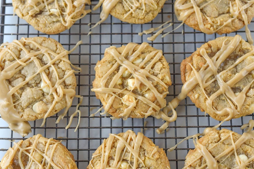 White Chocolate Chip Cookies with drizzled maple frosting