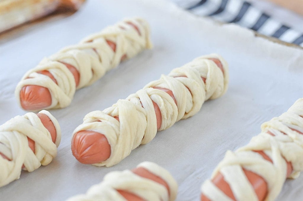 hot dog wrapped in pizza crust