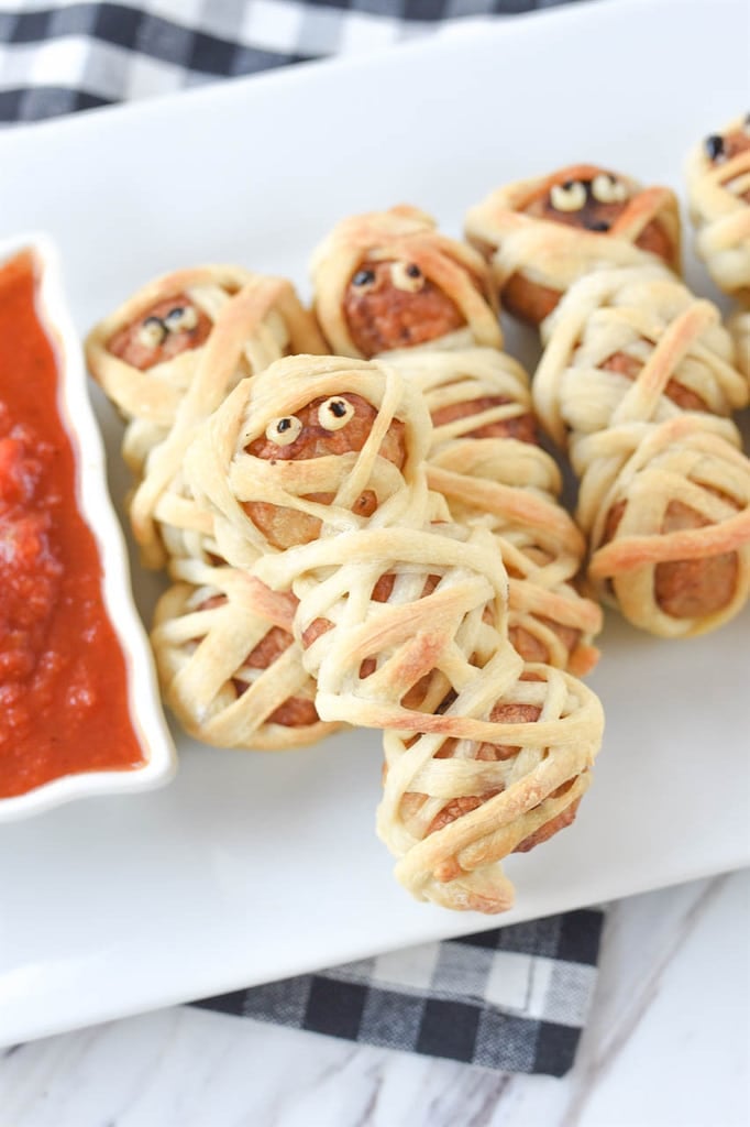 Mummy Meatballs on a white serving dish