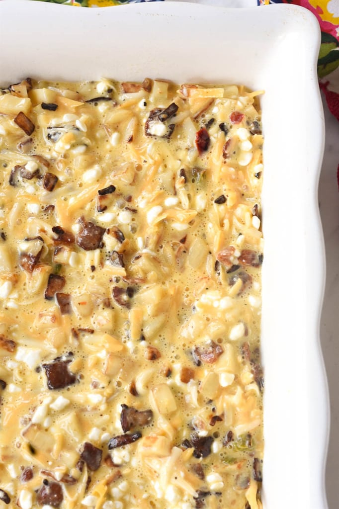 bacon egg and cheese breakfast casserole ready for the oven