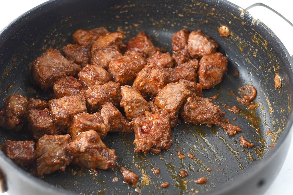 browning steak in a pan