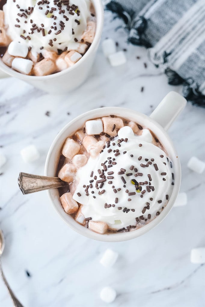 crock pot hot chocolate with whipped cream and sprinkles