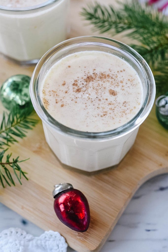 glass of egg nog with nutmeg on top