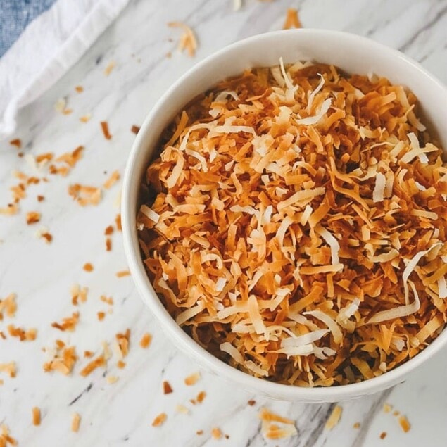 A bowl full of toasted coconut