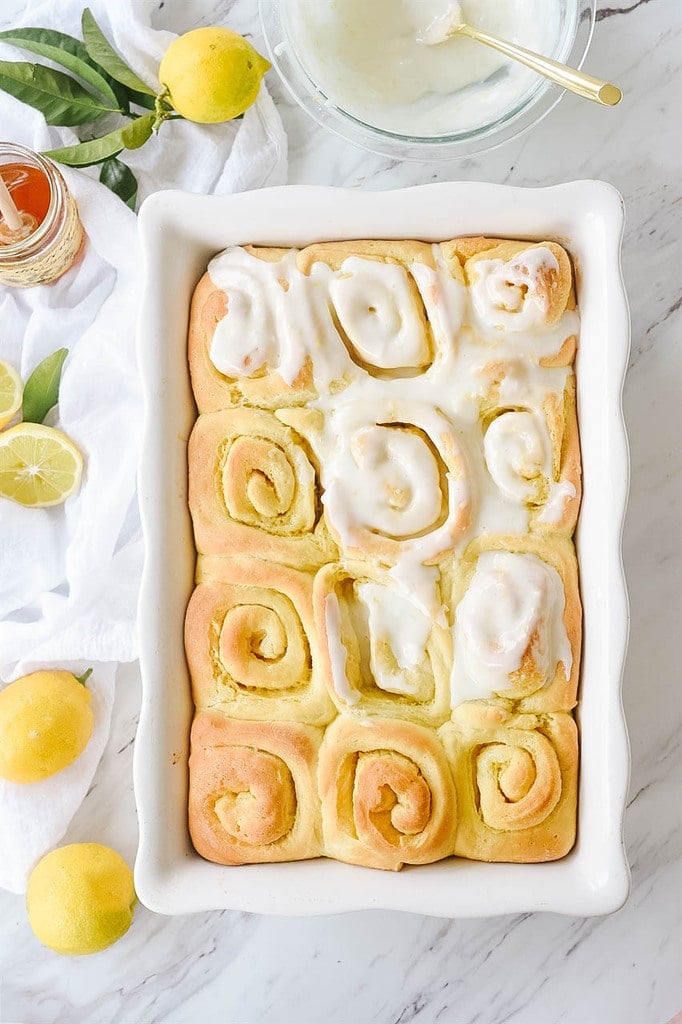 Lemon rolls being frosted