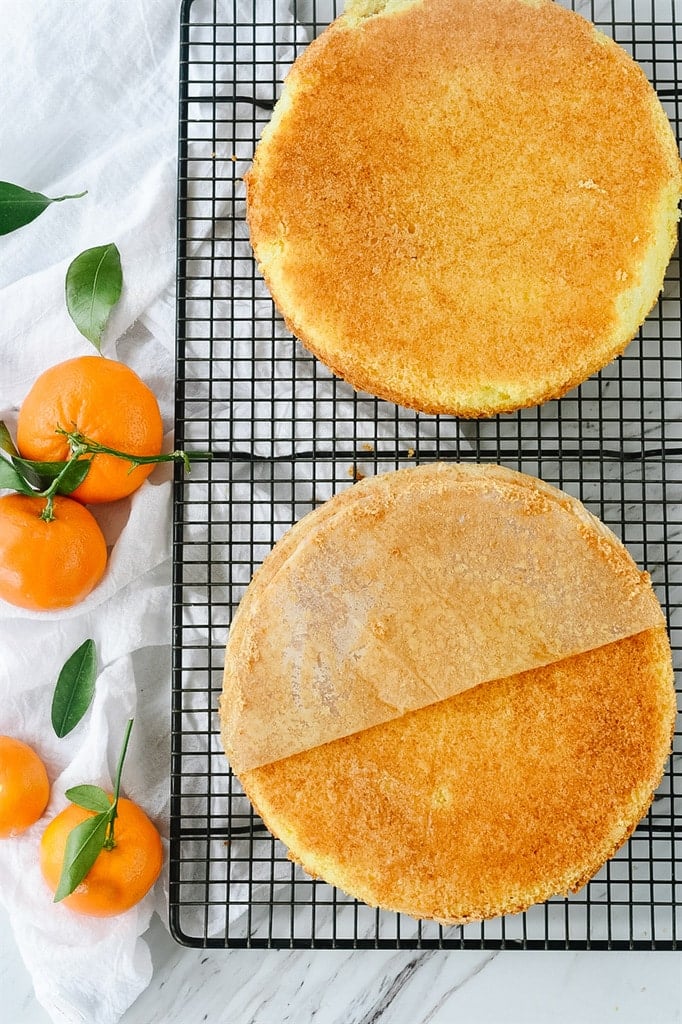 Orange cake cooling on rack