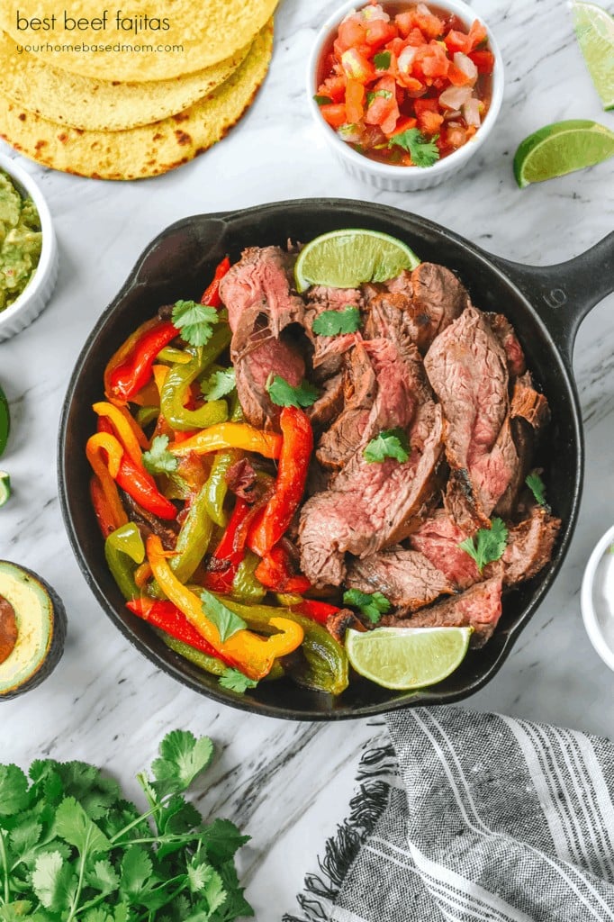 beef fajitas in a cast iron skillet