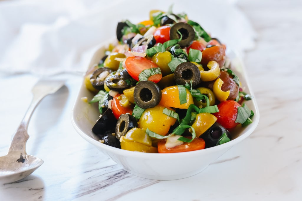 Tomato Olive Relish in bowl with spoon