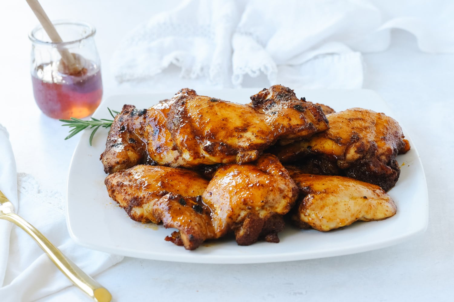 Glazed honey chicken on a plate.