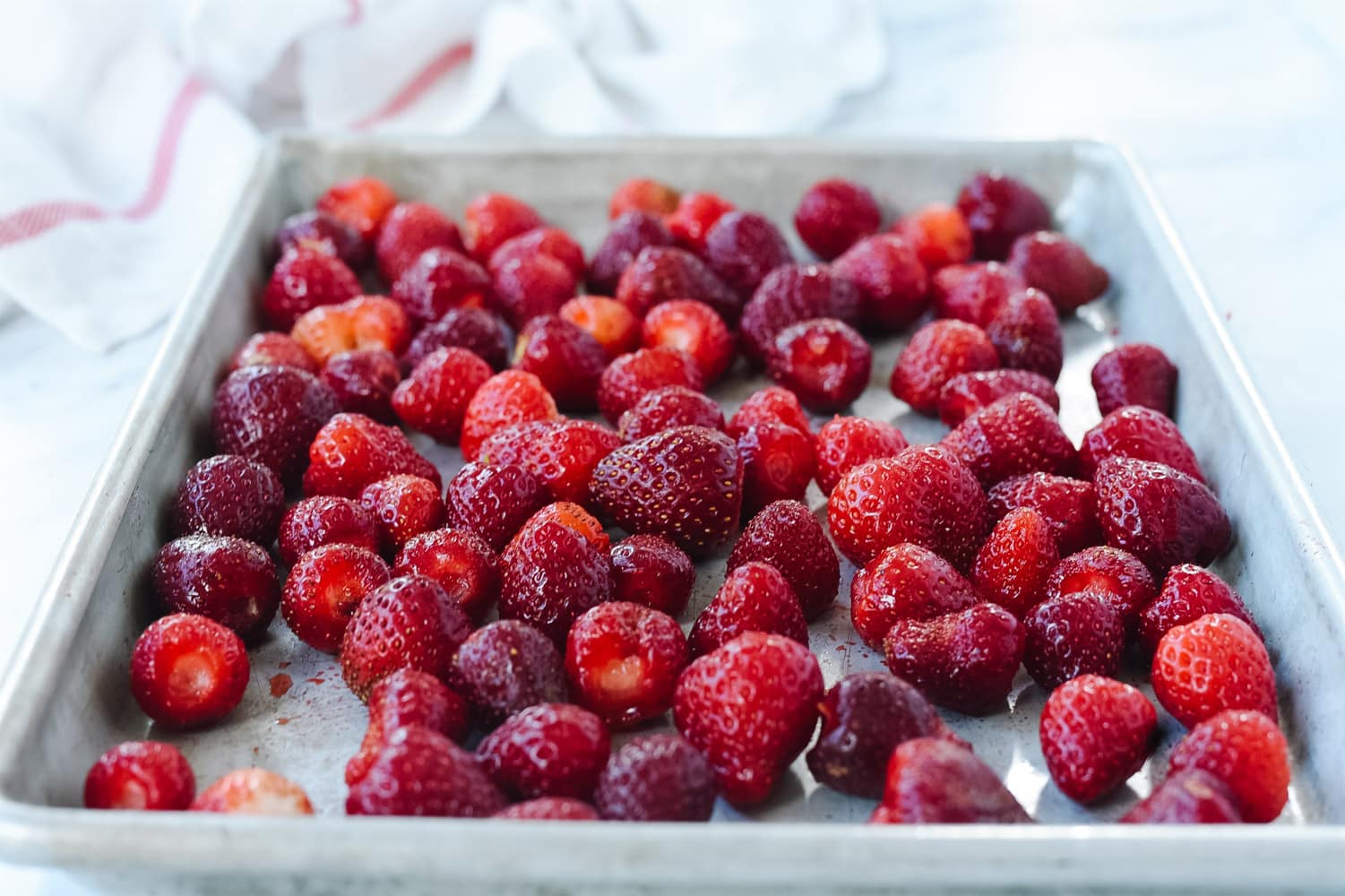 Strawberries in a layer on a pan