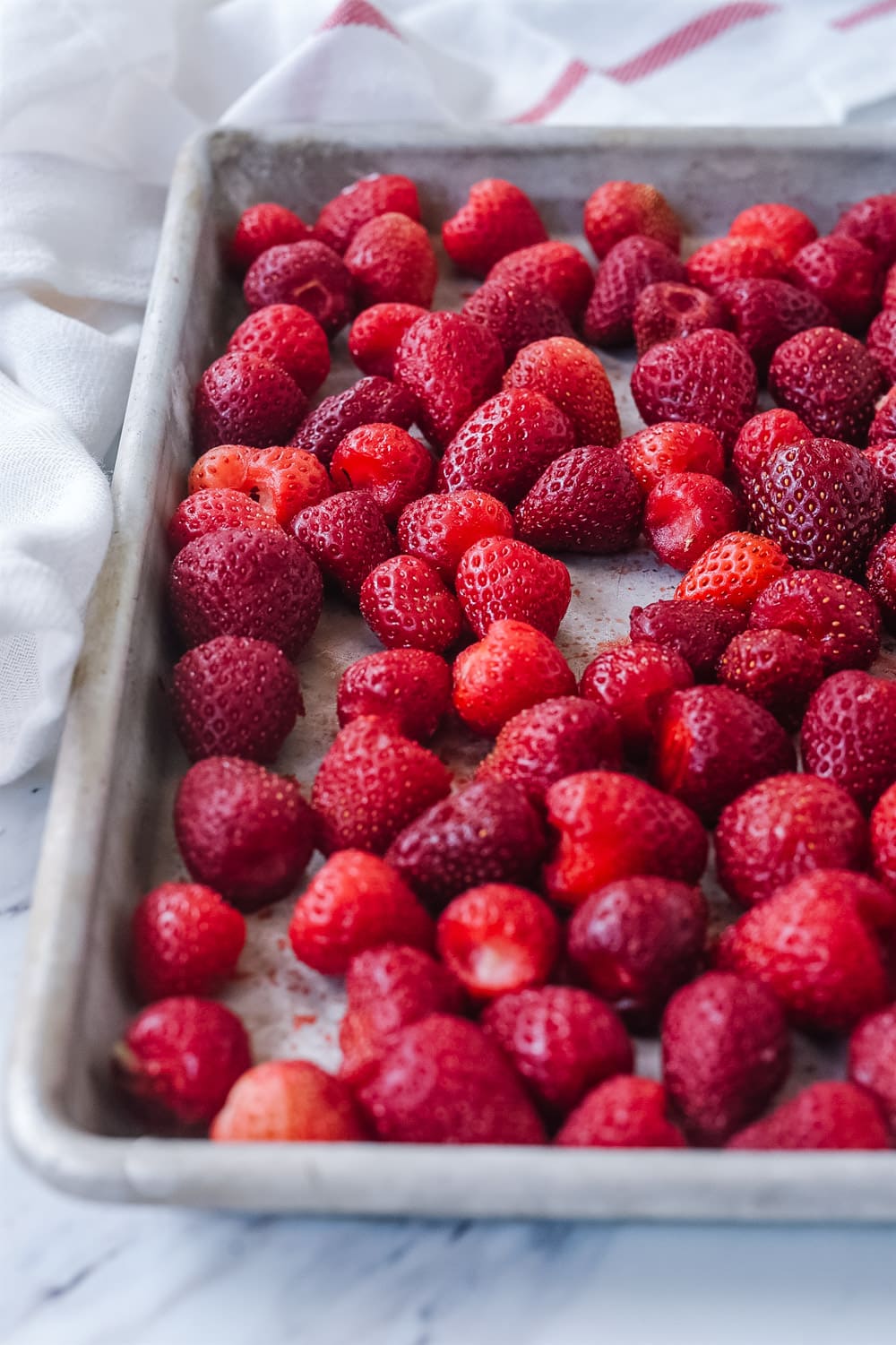 Frozen strawberries on a pan