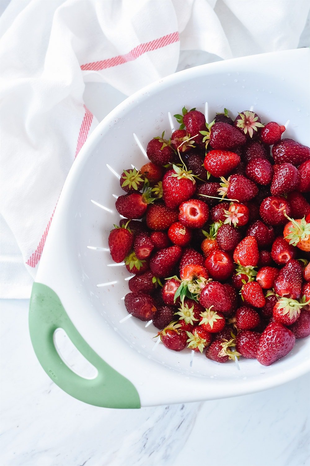 strawberries in a collander