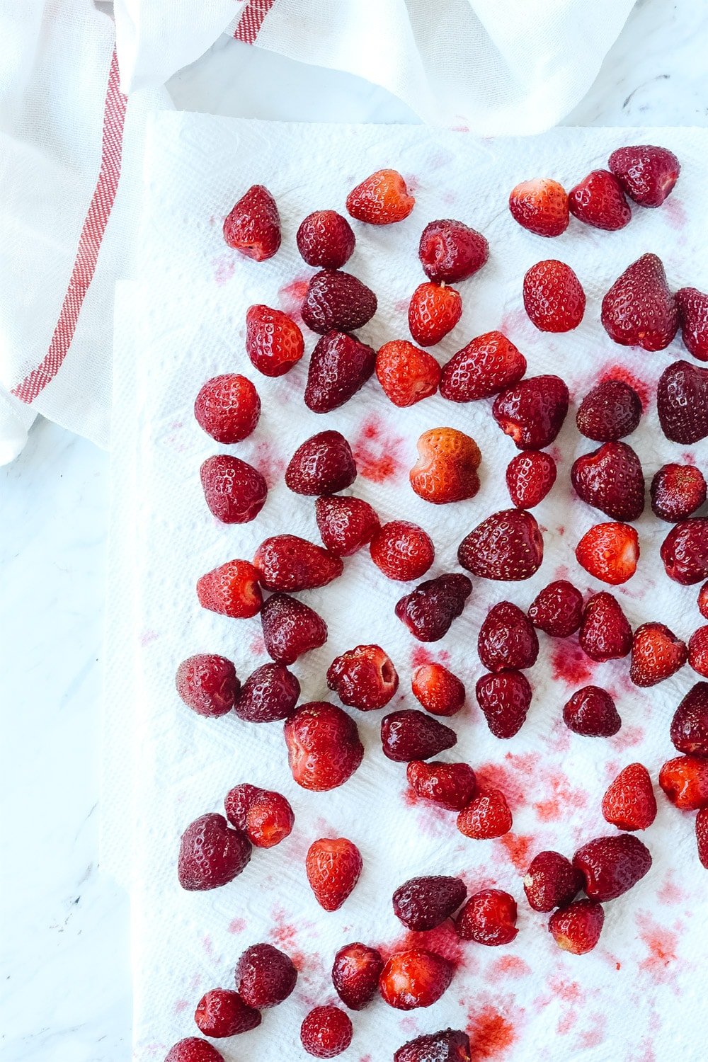 strawberries drying on paper towel