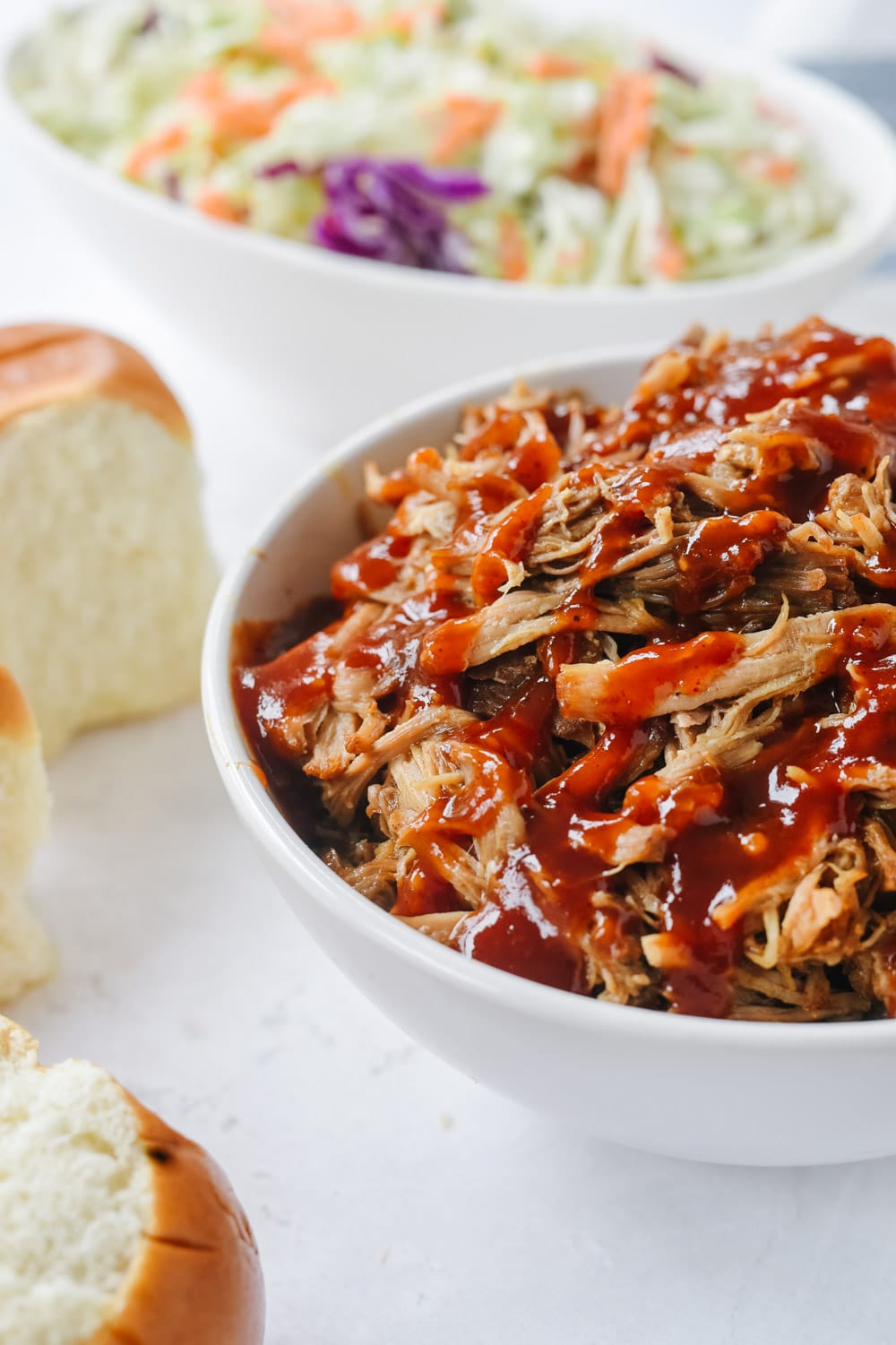 Instant Pot Pulled Pork in a bowl with BBQ Sauce
