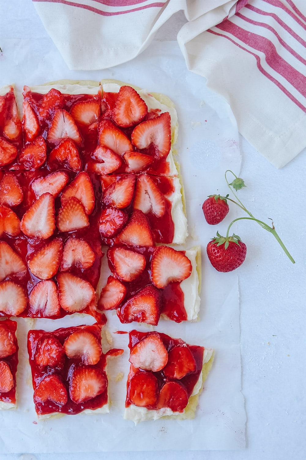 strawberry pizza on parchment paper