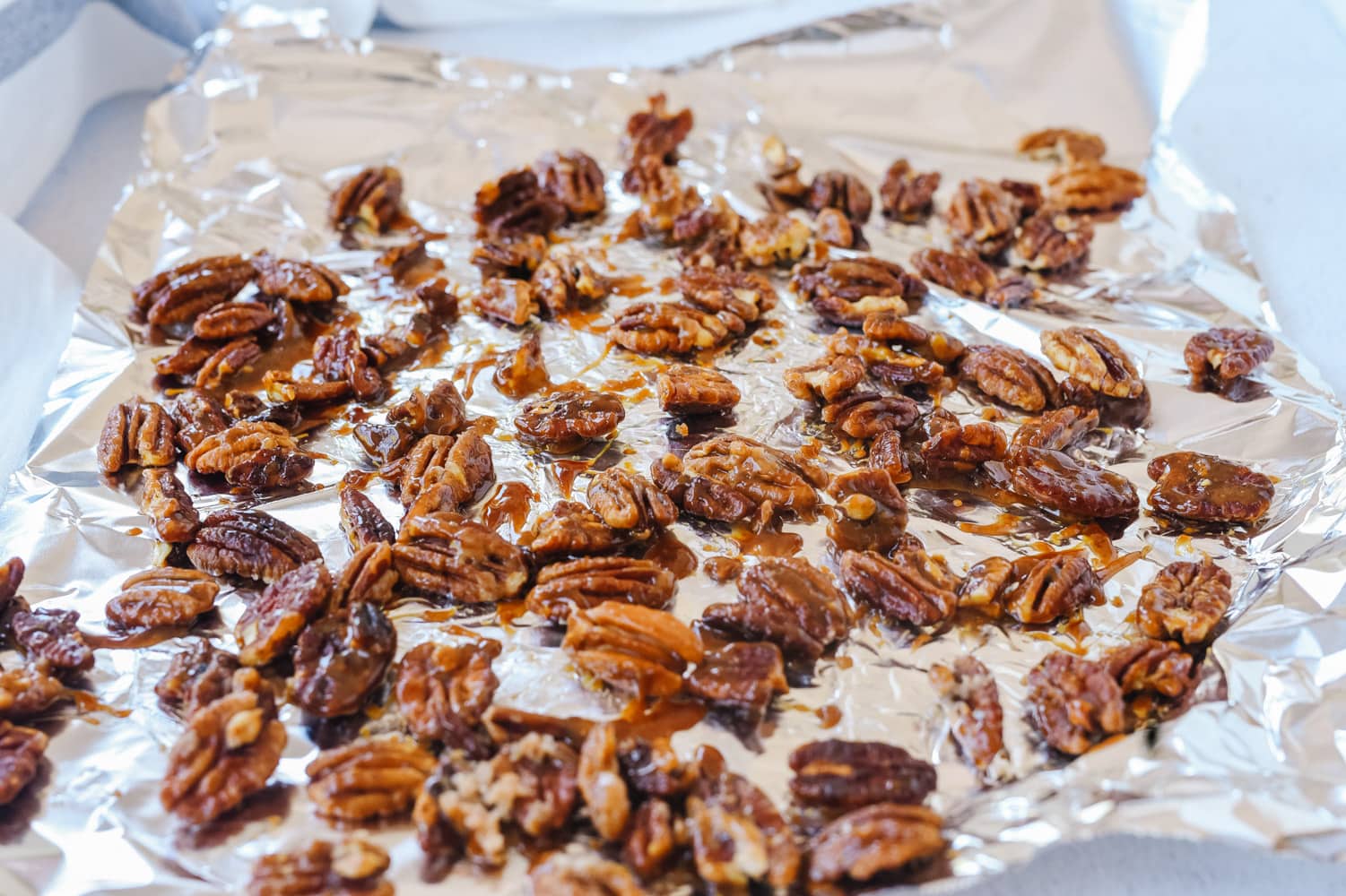 candied pecans on foil