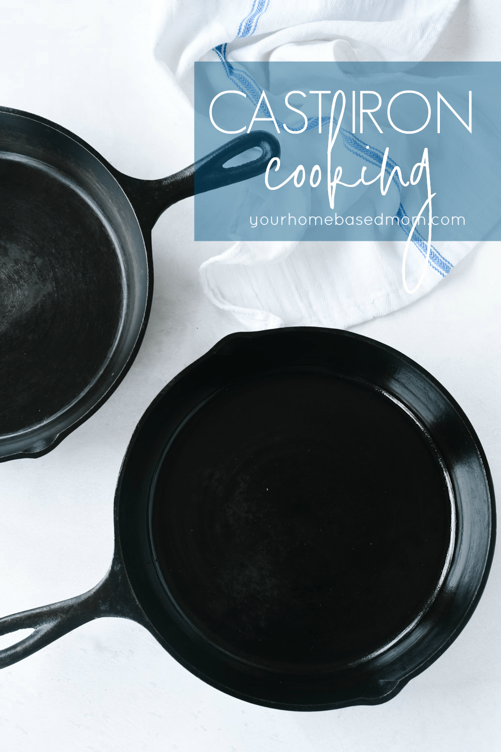 two cast iron pans and a towel