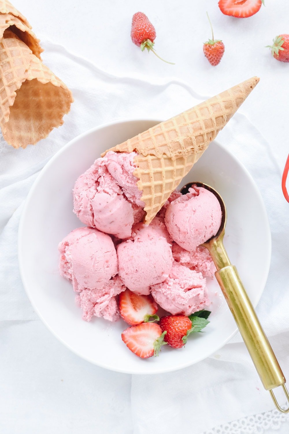 Bowl full of homemade strawberry ice cream