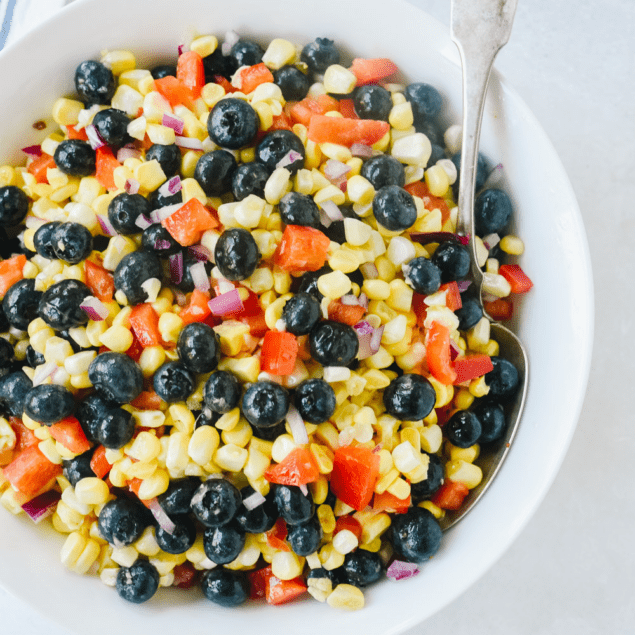 blueberry corn salad in a white bowl