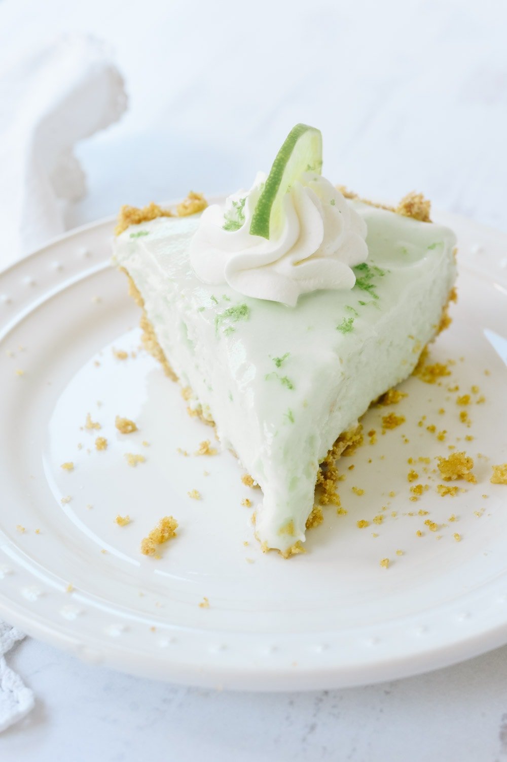 A slice of frozen key lime pie