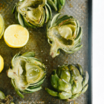 grilled artichokes on a tray