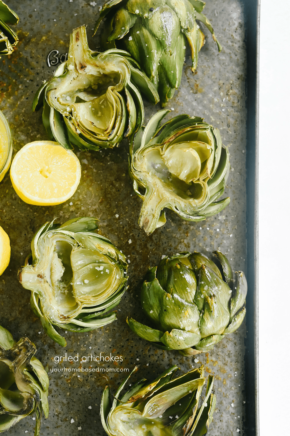 grilled artichokes on a tray