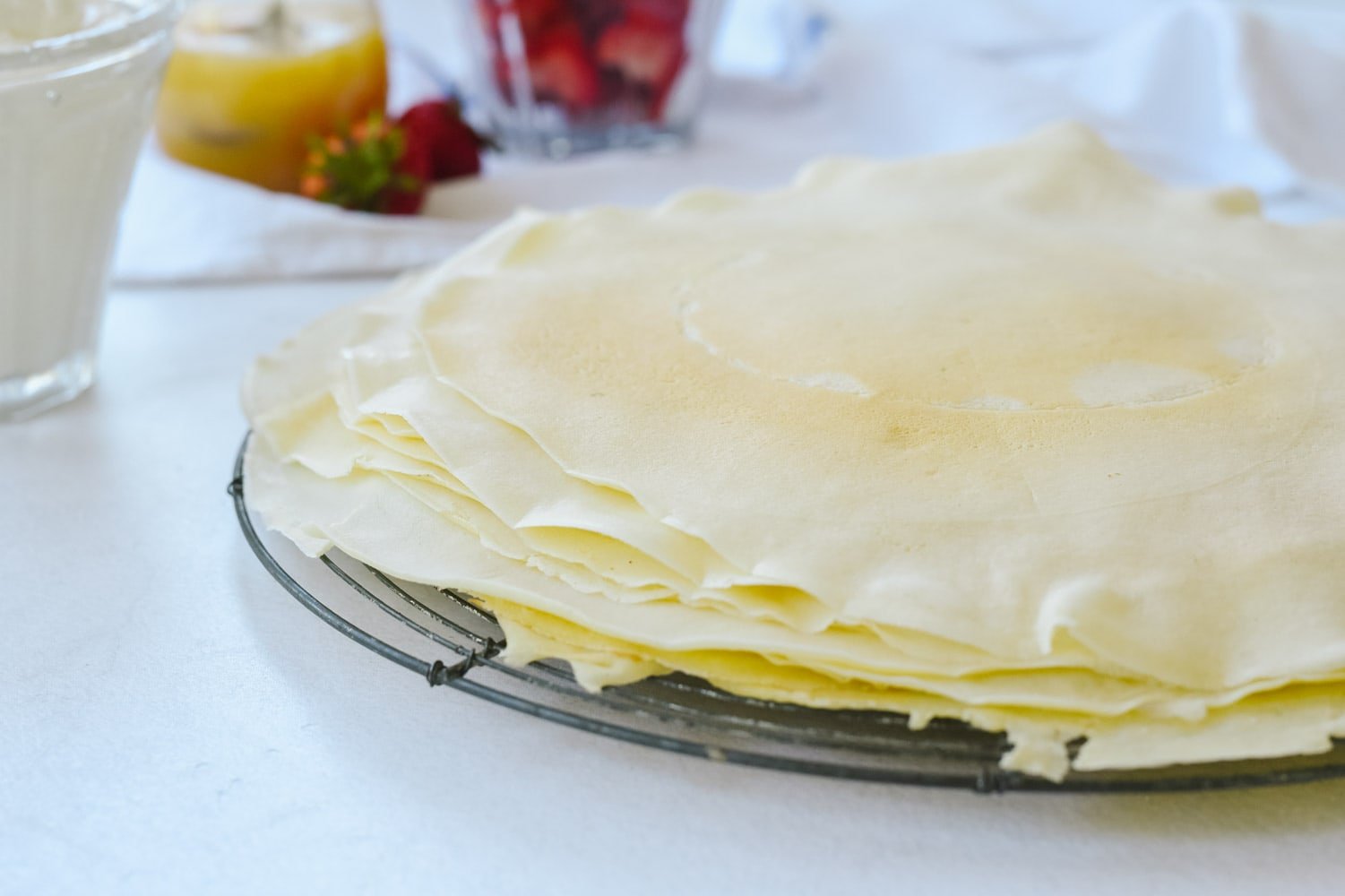 pile of crepes on a cooling rack