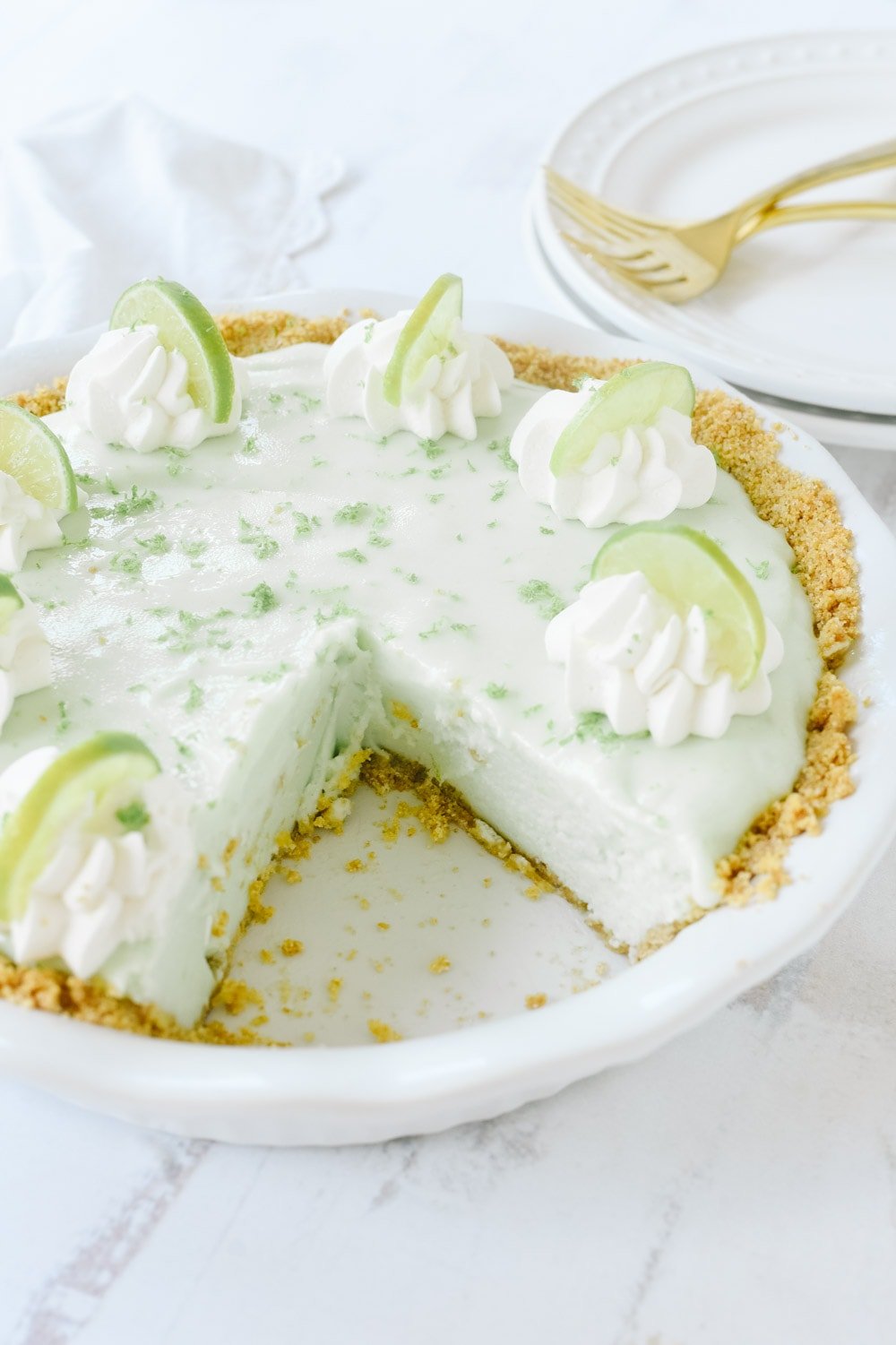 Frozen key lime pie with a piece missing