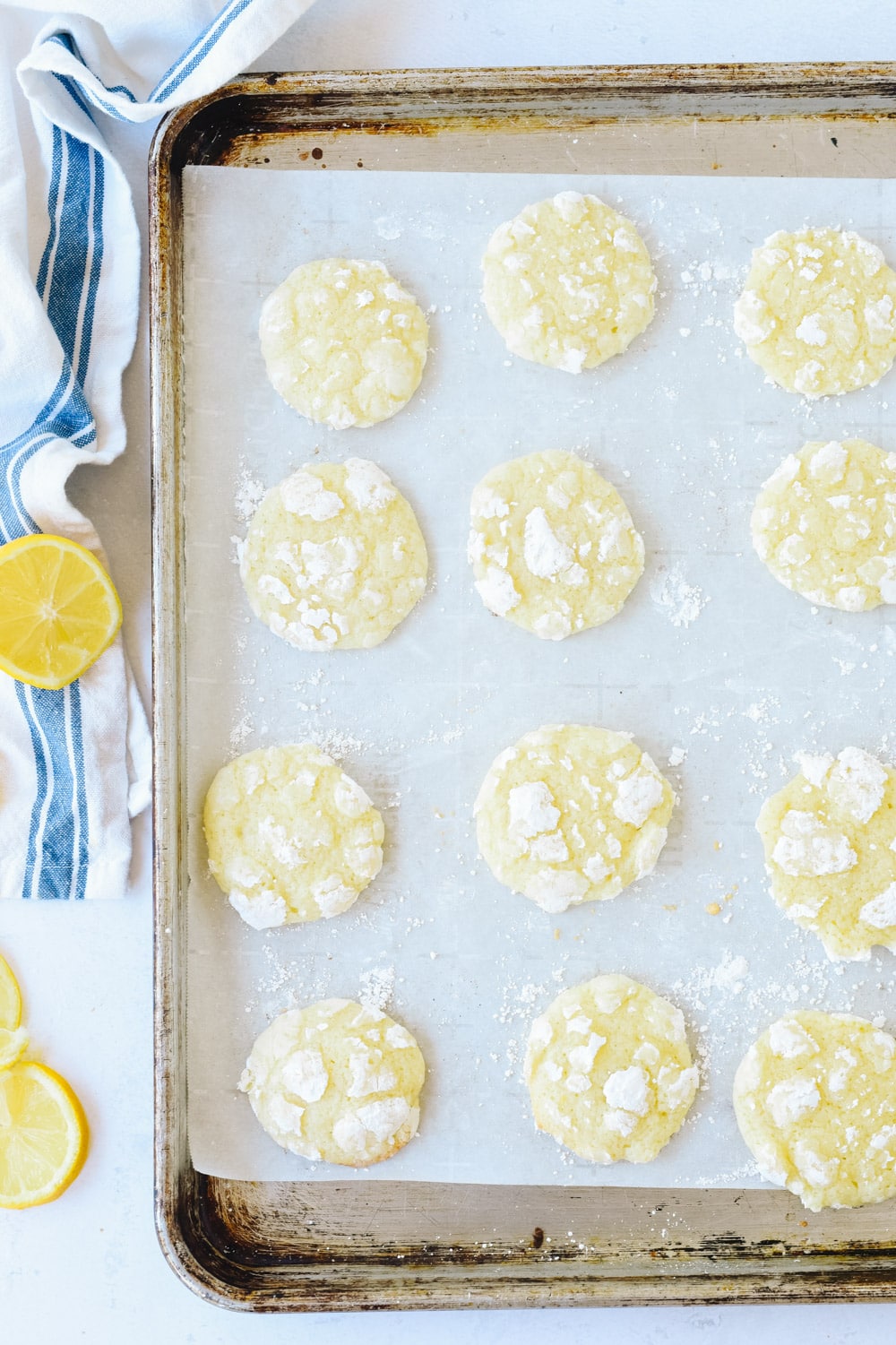 Lemon crinkles on a baking sheet