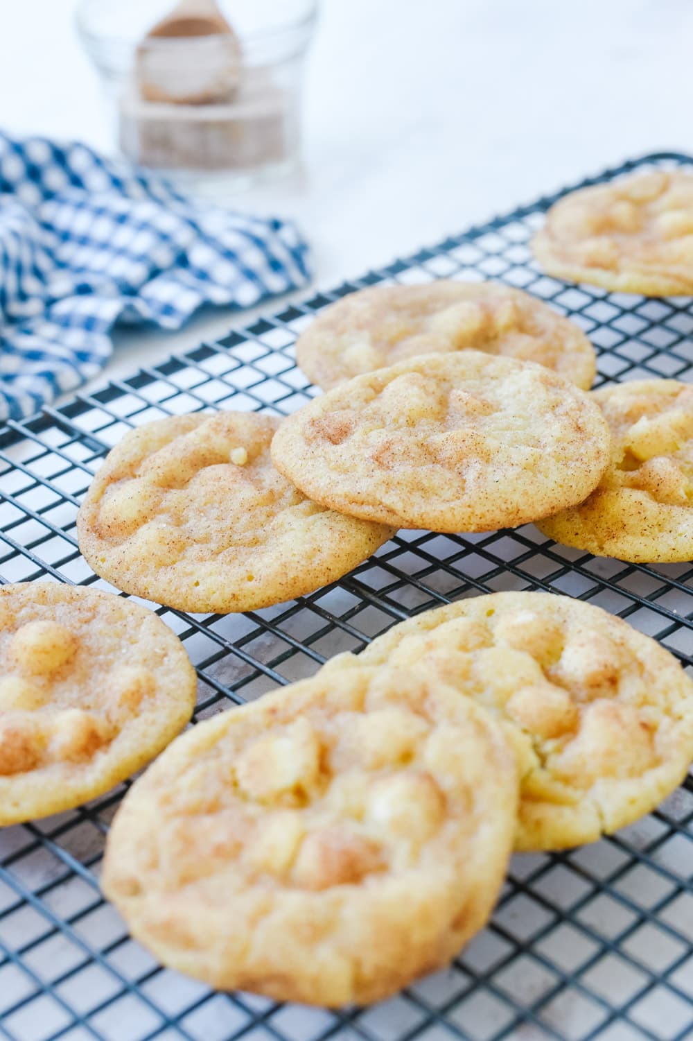 white chocolate snickerdoodle cookies on a cooling rack