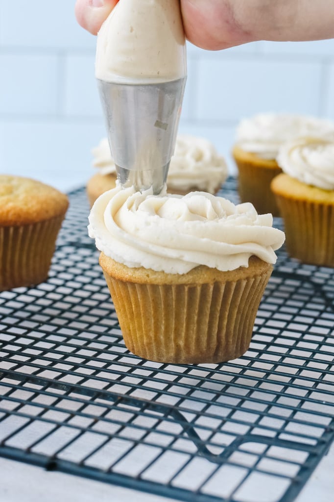 frosting a cupcake