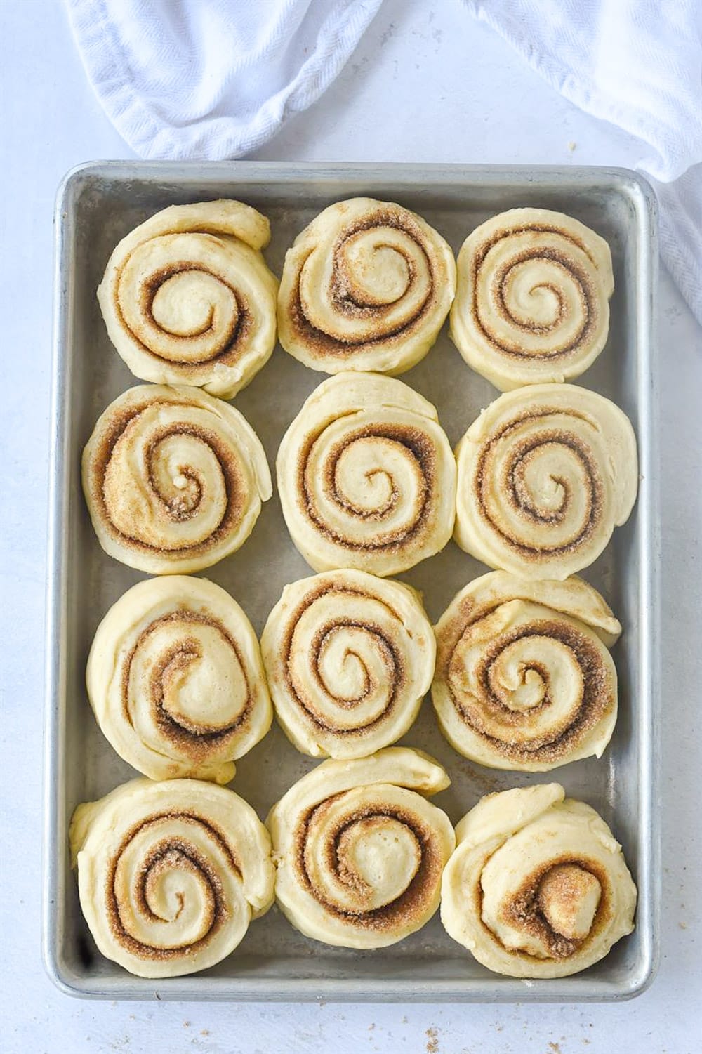 Cinnamon roll dough on baking sheet