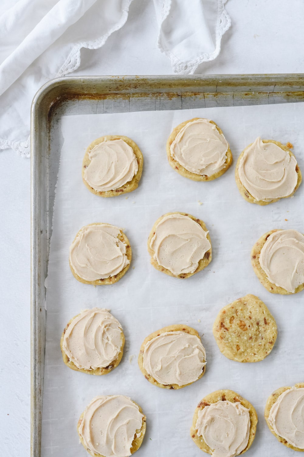 almond toffee cookies on a baking sheet