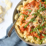 CHicken and Tomato Pasta in a bowl with a fork