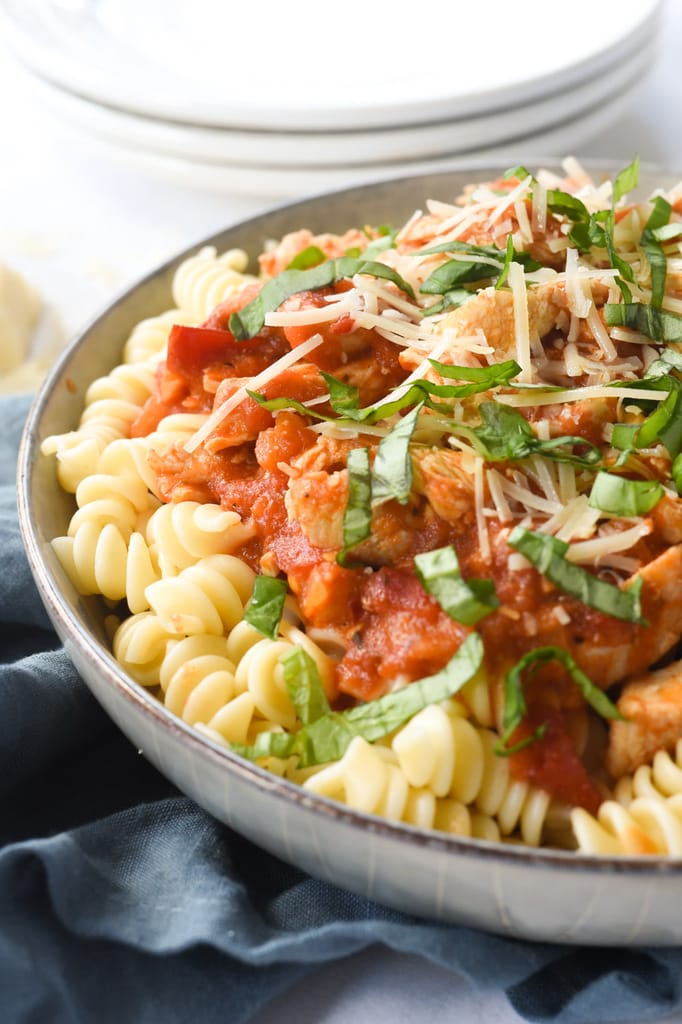 Chicken and fresh tomatoes over pasta