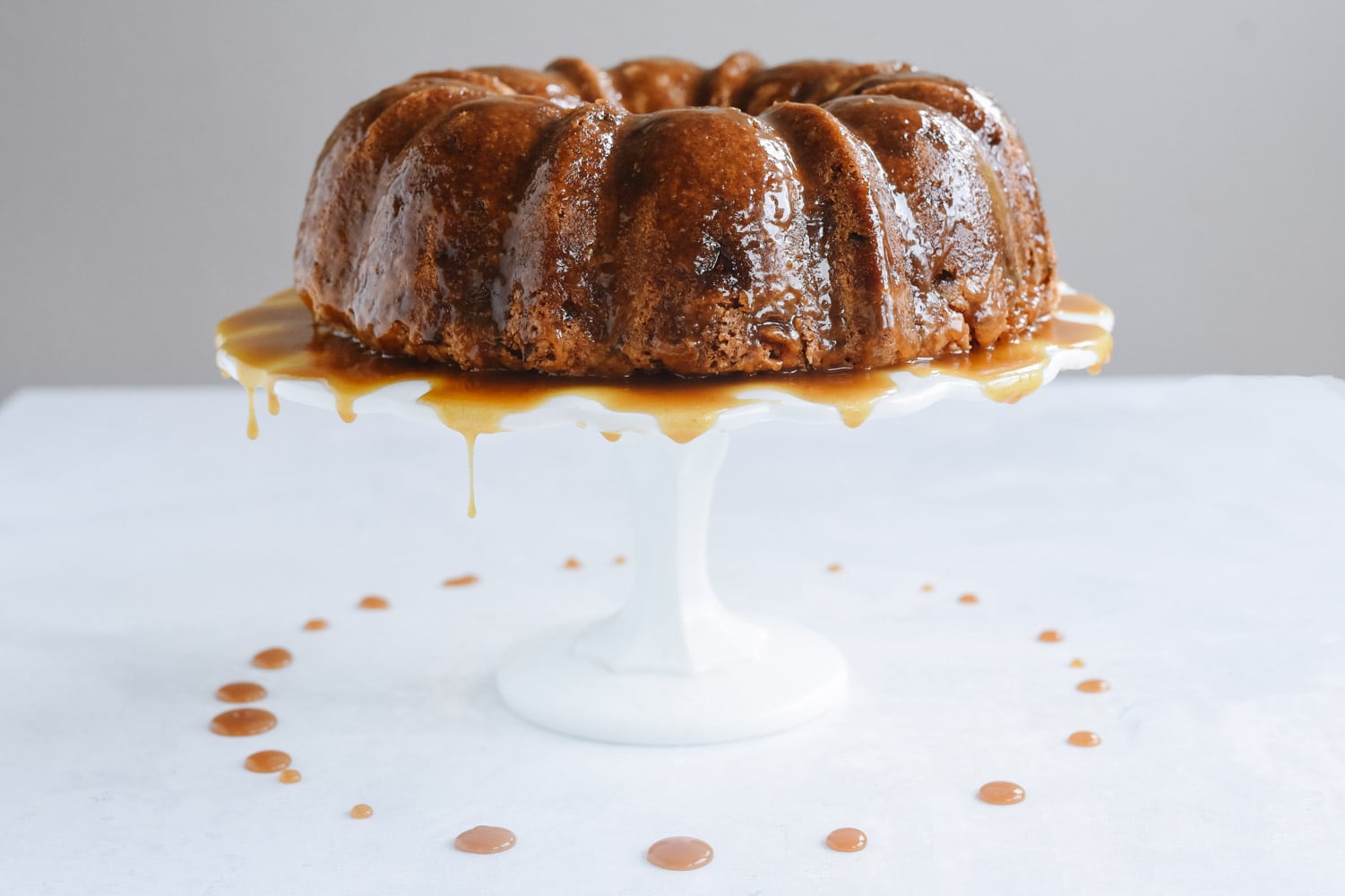 Apple Bundt Cake on a cake stand