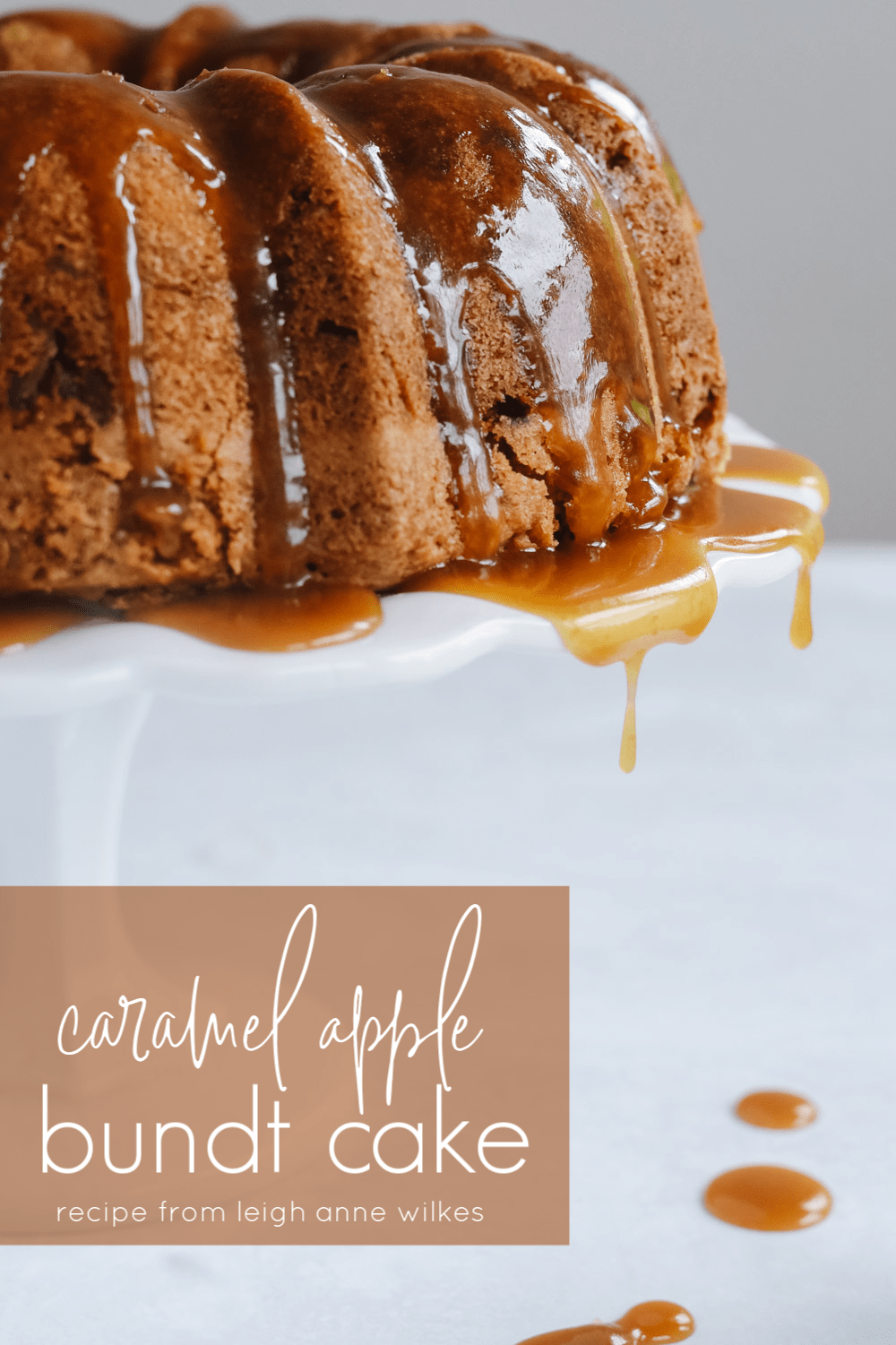 apple bundt cake with caramel sauce dripping off of it.