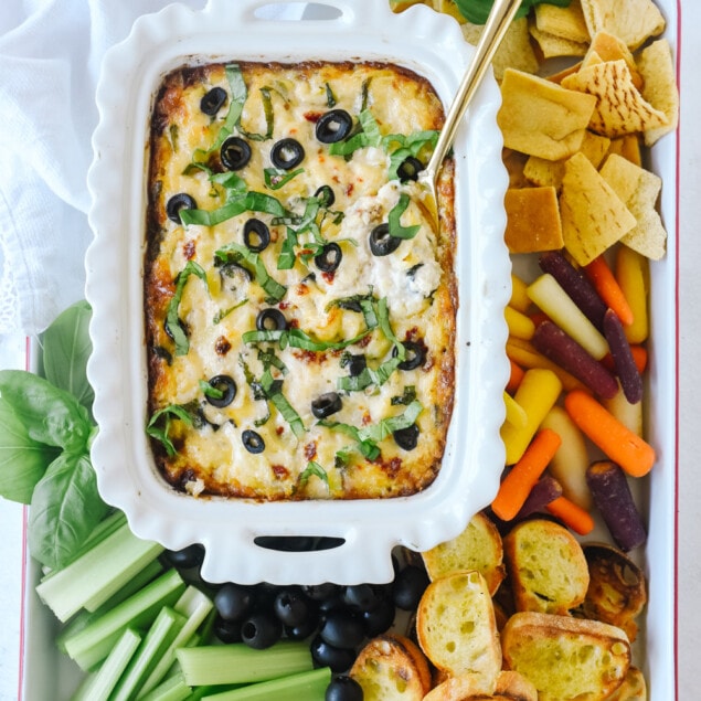 bowl of warm olive and artichoke dip