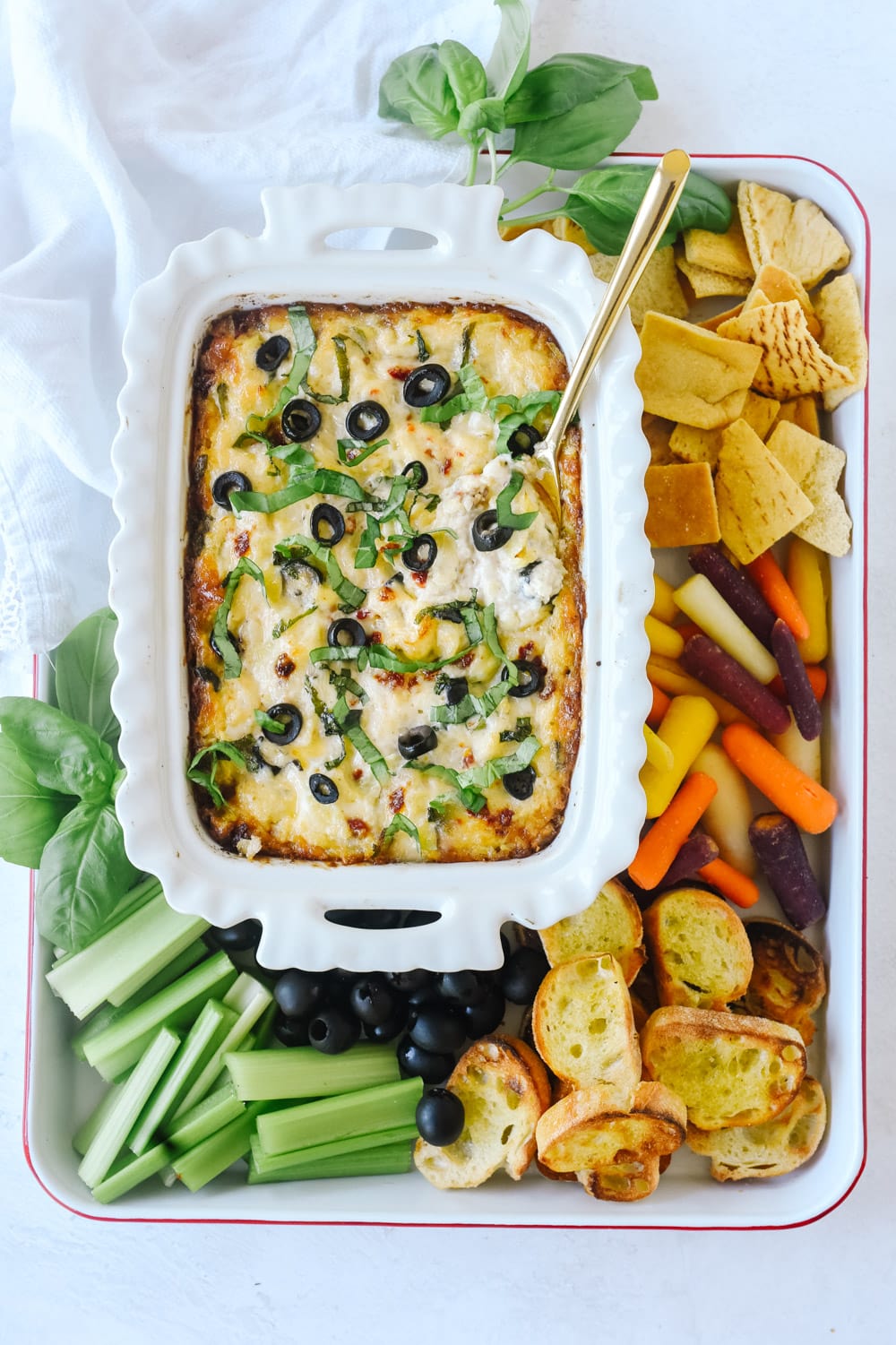 bowl of warm olive and artichoke dip