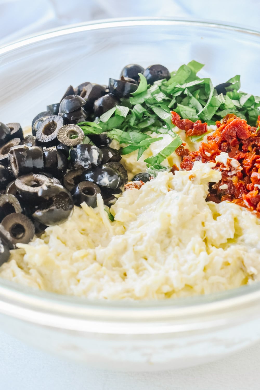 Ingredients for warm olive artichoke dip