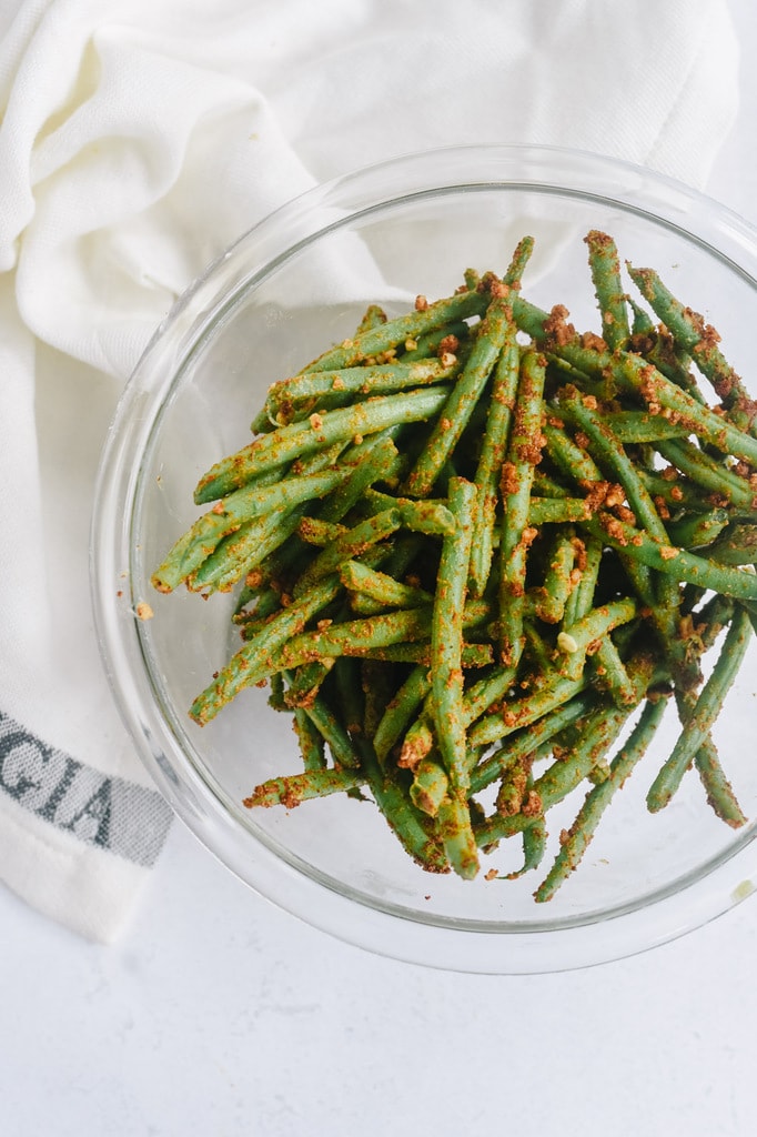 green beans with seasoning on them.