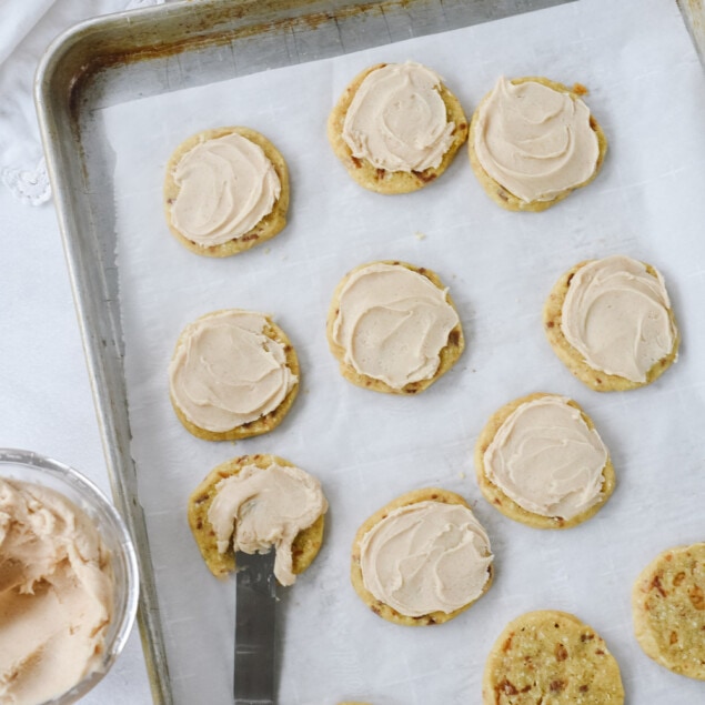 Frosting almond toffee cookies